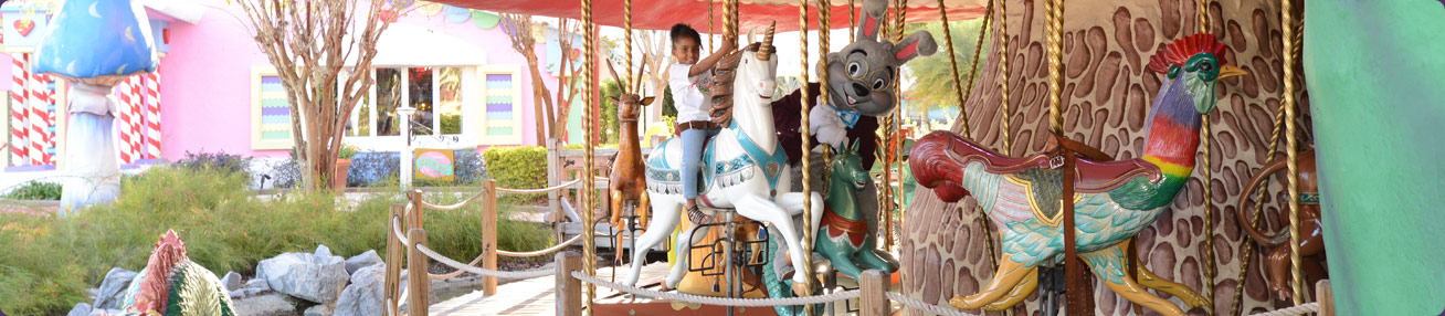 Girl with bunny on carousel